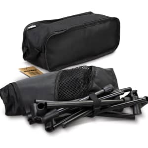A lightweight folding chair in a black storage bag, with disassembled frame pieces visible alongside.