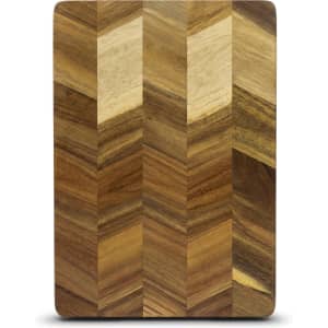 A rectangular chopping board featuring a chevron pattern in various shades of brown wood.