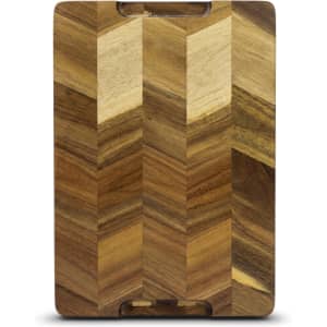 A wooden chopping board featuring a chevron pattern in various shades of brown. It has a logo on the surface.