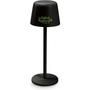 A black rechargeable table lamp with a round base and a cylindrical shade featuring a logo.