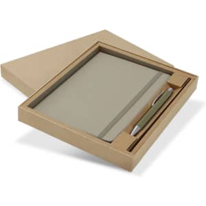 A green notebook and silver pen gift set displayed in a kraft paper box. The set includes a sleek design with a logo.