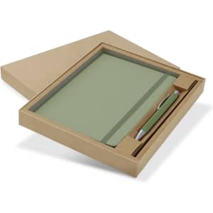 A green notebook and pen set displayed in a kraft gift box. The notebook is closed, and the pen is placed beside it.