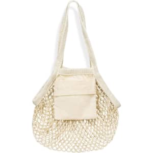 A small cotton mesh tote bag in cream colour with a solid front pocket and shoulder straps. It has a logo.