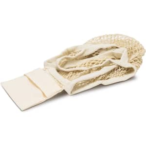 A small, cream-coloured cotton mesh foldaway tote bag with straps laid flat. It includes a section for folding.