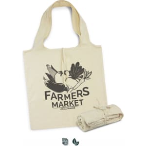 A cream-coloured foldaway tote bag displaying a graphic design and rolled for easy storage, featuring a logo.