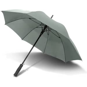 A large green umbrella with a black handle and a sturdy frame, featuring an umbrella logo on the handle.