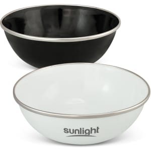 A black enamel bowl and a white enamel bowl with a silver rim, each featuring a logo.
