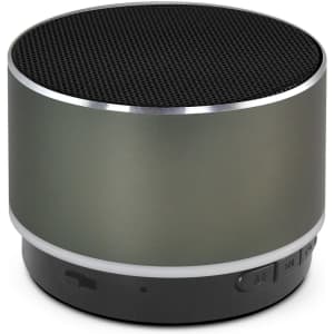 A round Bluetooth speaker in matte grey with a black speaker grill and a silver trim, featuring a branding logo.