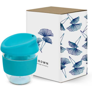 A drink bottle with a turquoise lid and band, paired with a decorative box featuring floral designs.