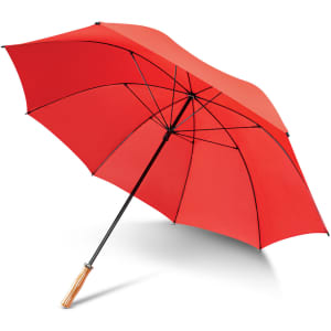 A red umbrella with a wooden handle and a black frame, featuring several ribs for support.