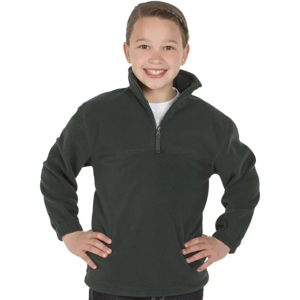 A child wearing a dark green 1/2 zip polar fleece jacket, smiling with hands on hips. The jacket has a logo.