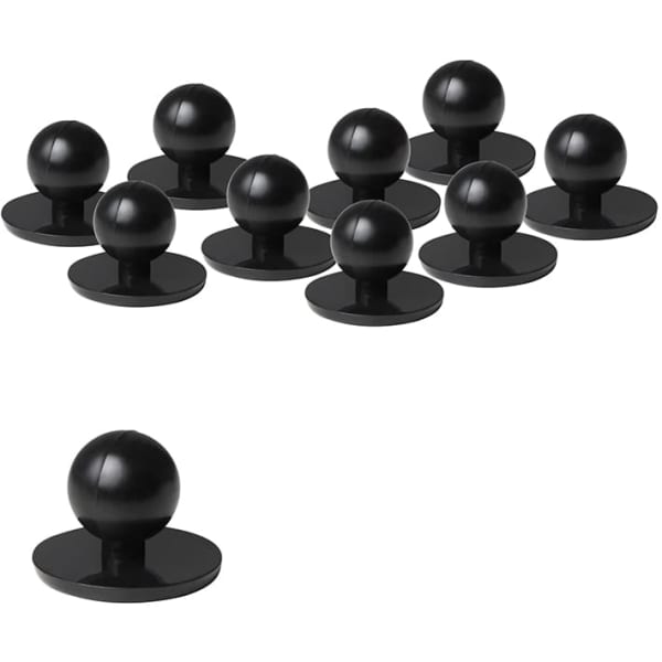 A set of ten black chef's buttons featuring a round shape on a flat base.
