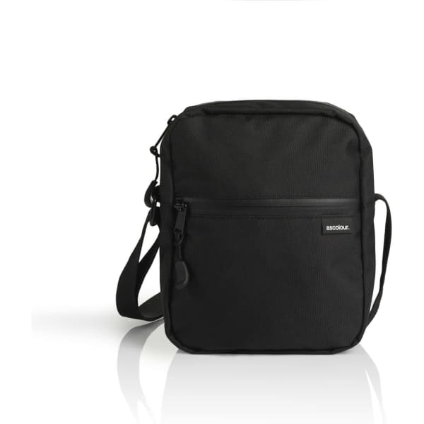 A black recycled transit bag with a front zip pocket and an adjustable shoulder strap. It features a logo.