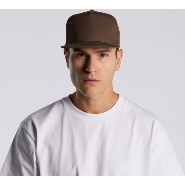 A brown trucker cap with a mesh back, worn by a model in a white t-shirt, facing forward.
