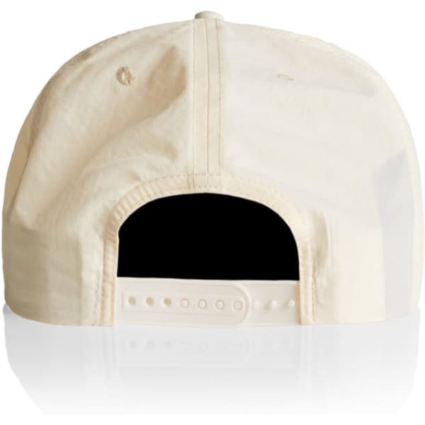 A cream-coloured cap with an adjustable strap at the back and a logo on the side.
