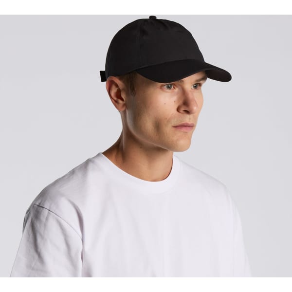 A black cap worn by a man, featuring a logo and a classic design. The man is dressed in a plain white T-shirt.