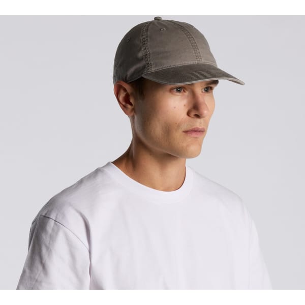 A faded grey cap is being worn by a person with short hair, paired with a plain white t-shirt.