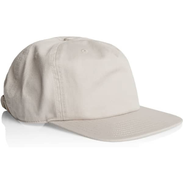 A beige five-panel cap with a flat brim and a logo on the side.