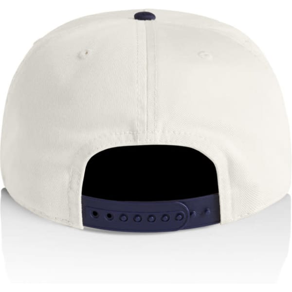 A two-tone cap featuring a cream body and navy peak, with an adjustable snapback closure.
