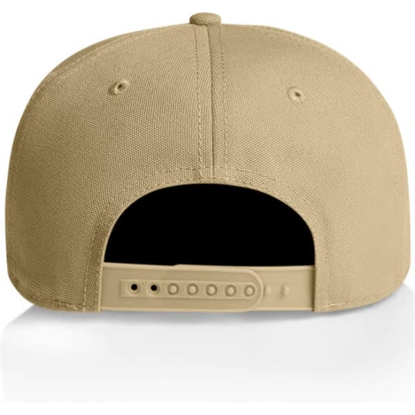 A tan cap with a snapback closure, featuring a smooth texture and ventilation holes. The inside is mostly black.