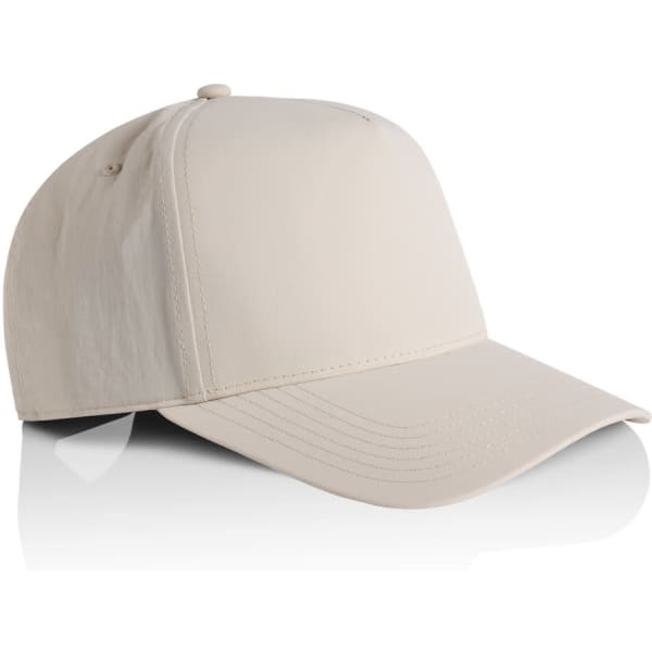 A beige nylon cap with a curved brim and a structured design, featuring a logo on the side.