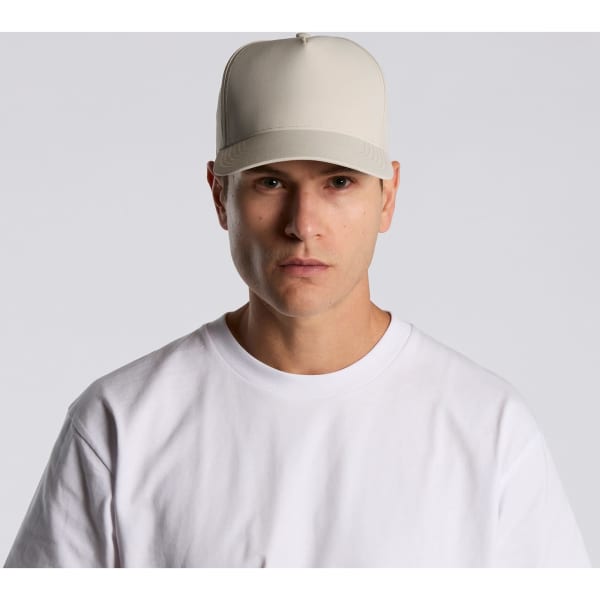 A beige cap made of nylon, featuring a structured design and a logo on the front.