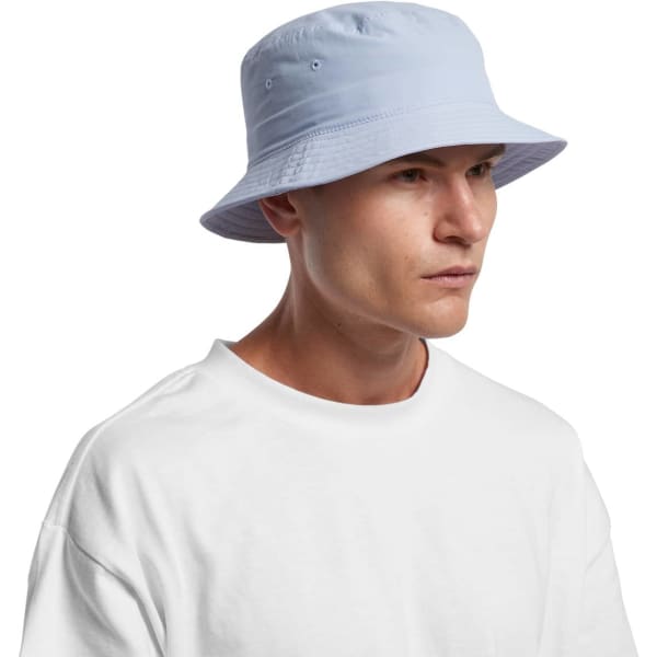 A blue nylon bucket hat with a structured brim, worn by a person in a white t-shirt. The hat features eyelets for ventilation.