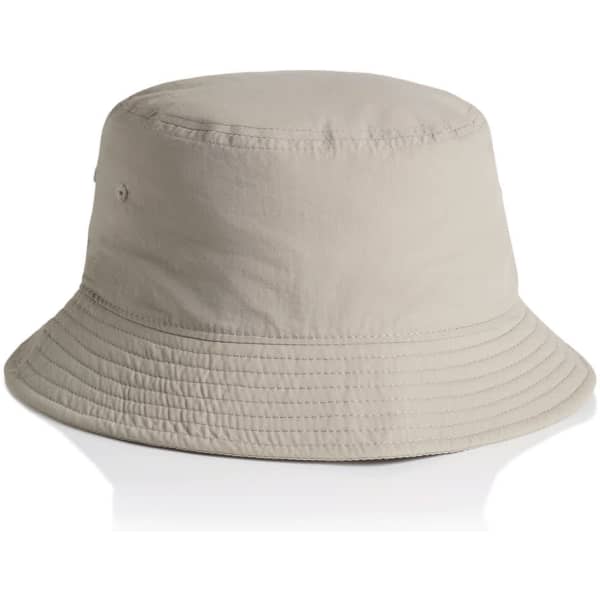 A beige nylon bucket hat with a wide brim and a logo on the side.