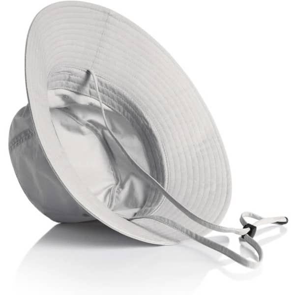 A wide-brim bucket hat in light grey, featuring a strap and a shiny interior, with a logo present.