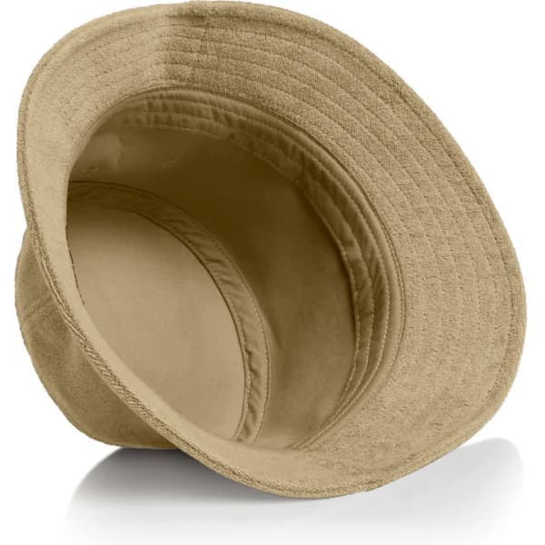 A tan Terry Bucket Hat with a wide brim, featuring a soft interior and a logo inside.