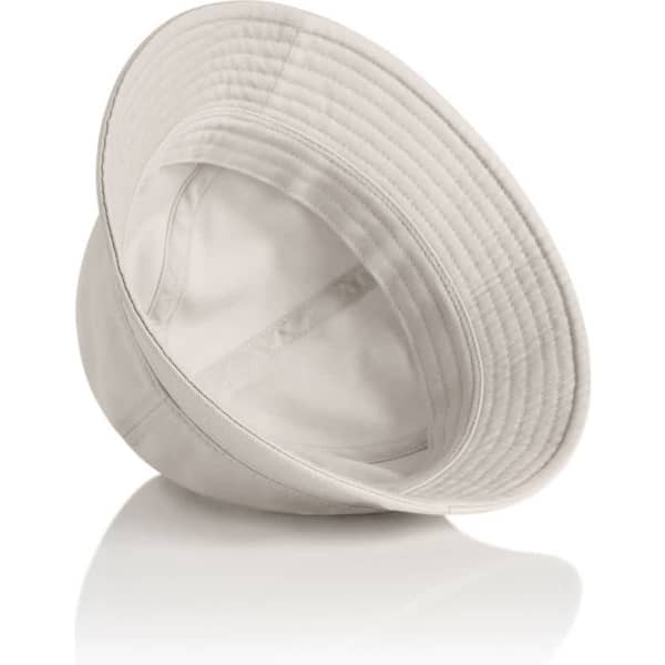 A light beige bucket hat with a wide brim and a logo inside. It rests on a reflective surface.