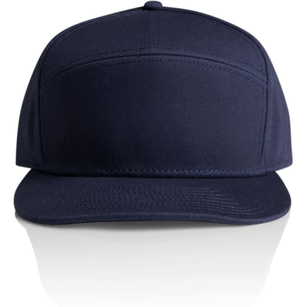 A navy 7-panel cap with a flat brim and a logo on the front.