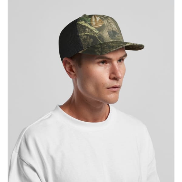 A camo cap featuring a mesh back, in shades of green and brown, worn by a model. The cap includes a logo.