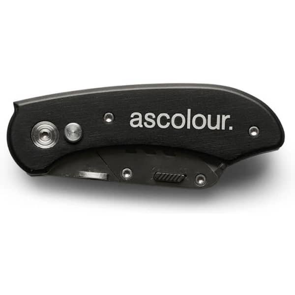 A black utility knife with a folding design and a logo on the handle.