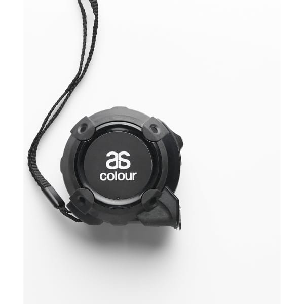 A black tape measure with a textured grip and a cord attached, featuring a logo on its front.