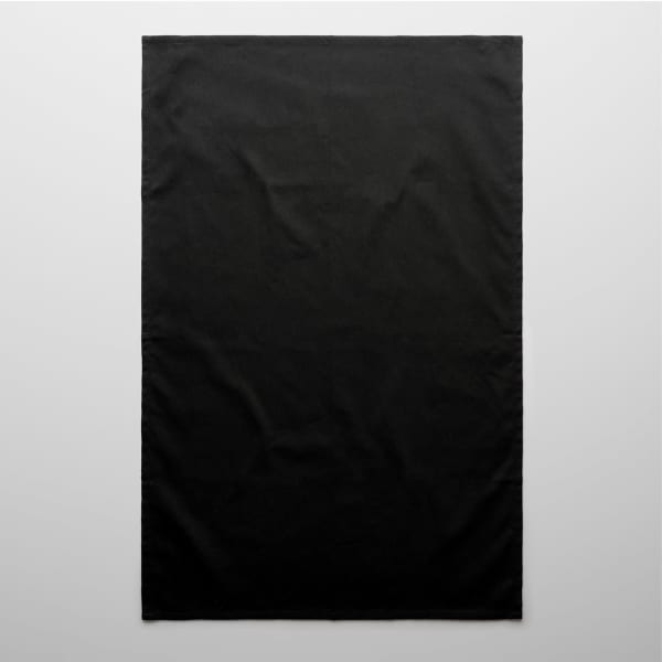 A black tea towel with a plain design. It has a subtle texture and includes a logo.