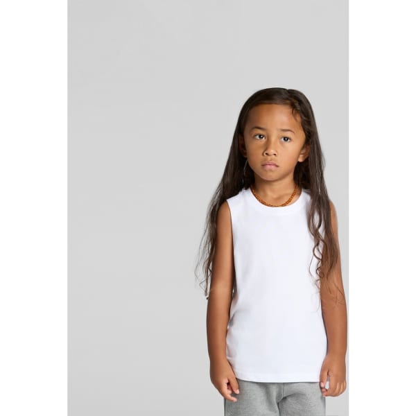 A white sleeveless tank top for kids, displayed on a child with long hair. The top features a logo.