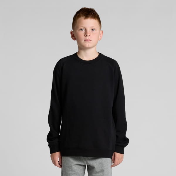 A black jumper sweater for youth, featuring a classic design and a relaxed fit. It has a branding logo.