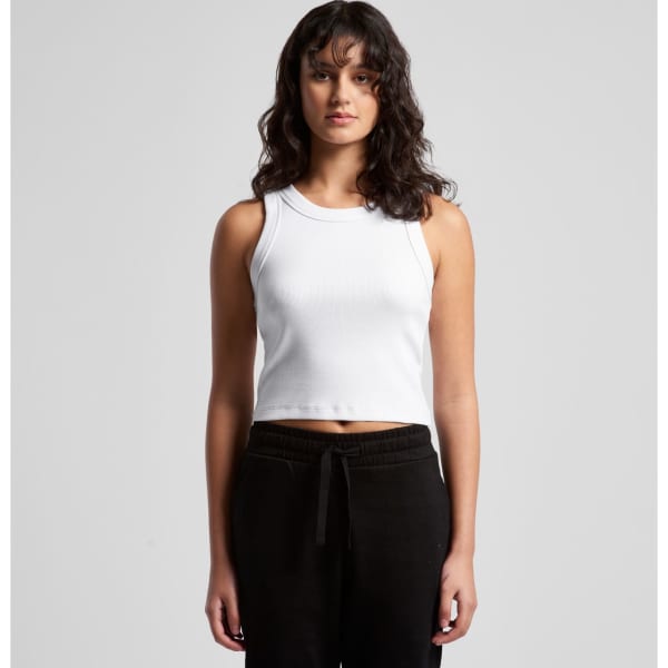 A white ribbed crop tank top is displayed on a model, paired with black pants. The top features a round neckline and a fitted style.