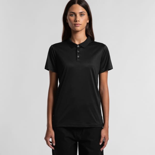 A black active work polo featuring a collar and button placket, modelled by a woman against a neutral background.