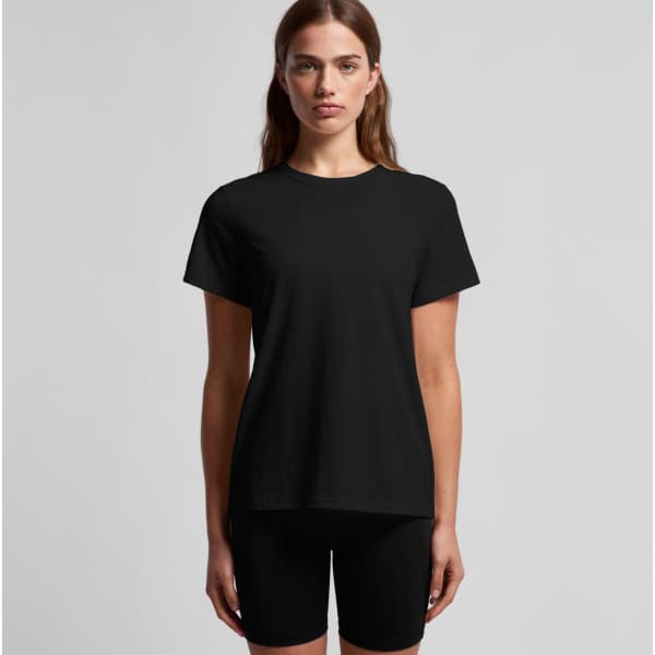 A black T-shirt featuring a simple design, displayed on a model, paired with black shorts. The shirt has a logo.