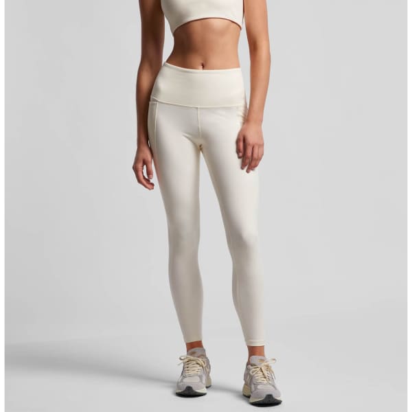 Active leggings in cream colour, featuring a high waistband and form-fitting design. Includes branding on the waistband.