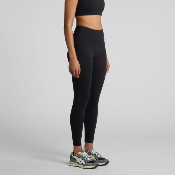 Active seamless leggings in black, featured on a model, paired with athletic shoes. The product includes a logo.