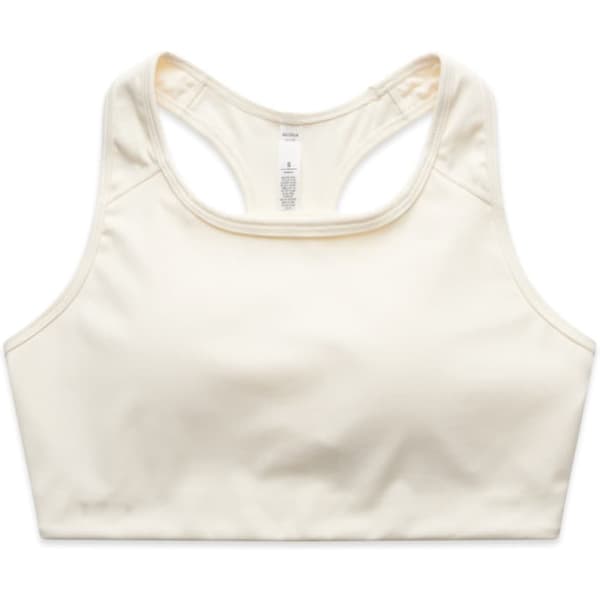 A cream-coloured active bra top with a racerback design and a small logo.