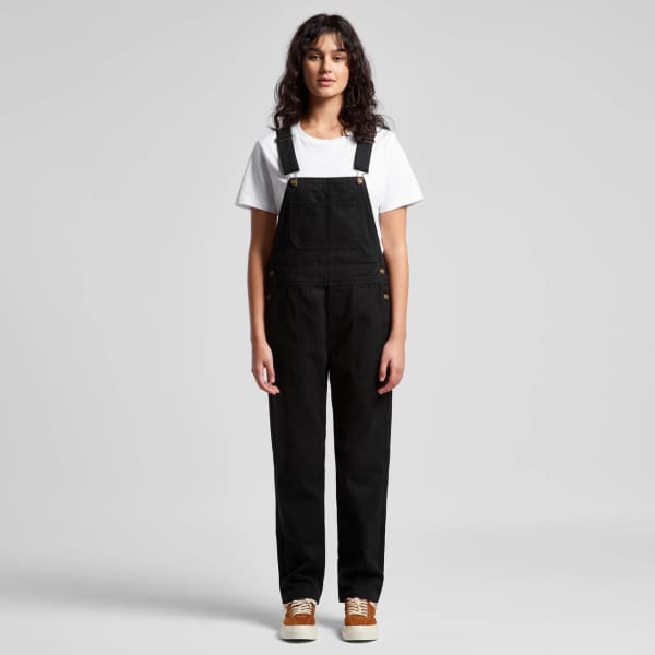 Black canvas overalls worn over a white t-shirt, featuring adjustable straps and pockets, with a logo present.