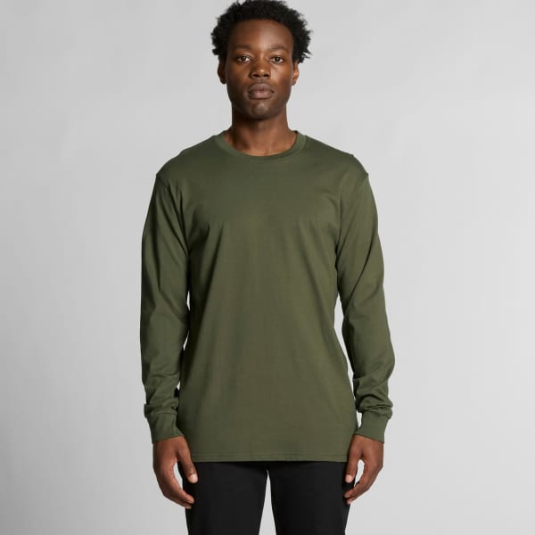 A long-sleeve T-shirt in olive green, featuring a logo, worn by a model against a neutral background.