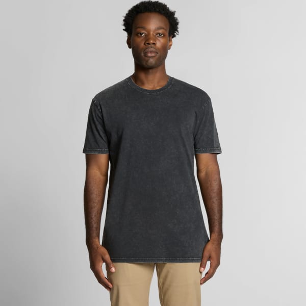 A black stone wash t-shirt with stitching details, displayed on a male model against a plain background.