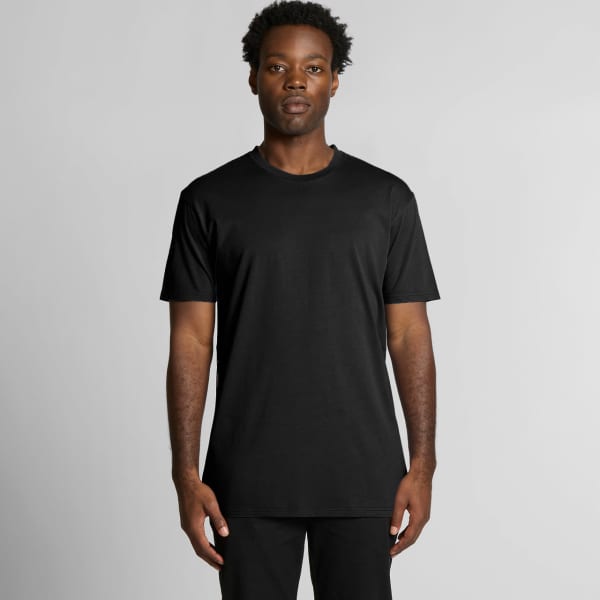 A black t-shirt displayed on a model, featuring short sleeves and a relaxed fit. It has a logo on the garment.