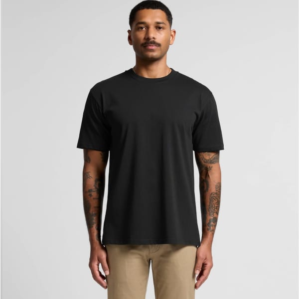 A black t-shirt with short sleeves, featuring a logo, displayed on a model standing upright.