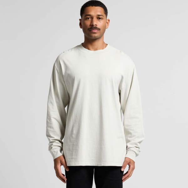 A long-sleeve T-shirt in a faded cream colour, featuring a relaxed fit and a small logo.